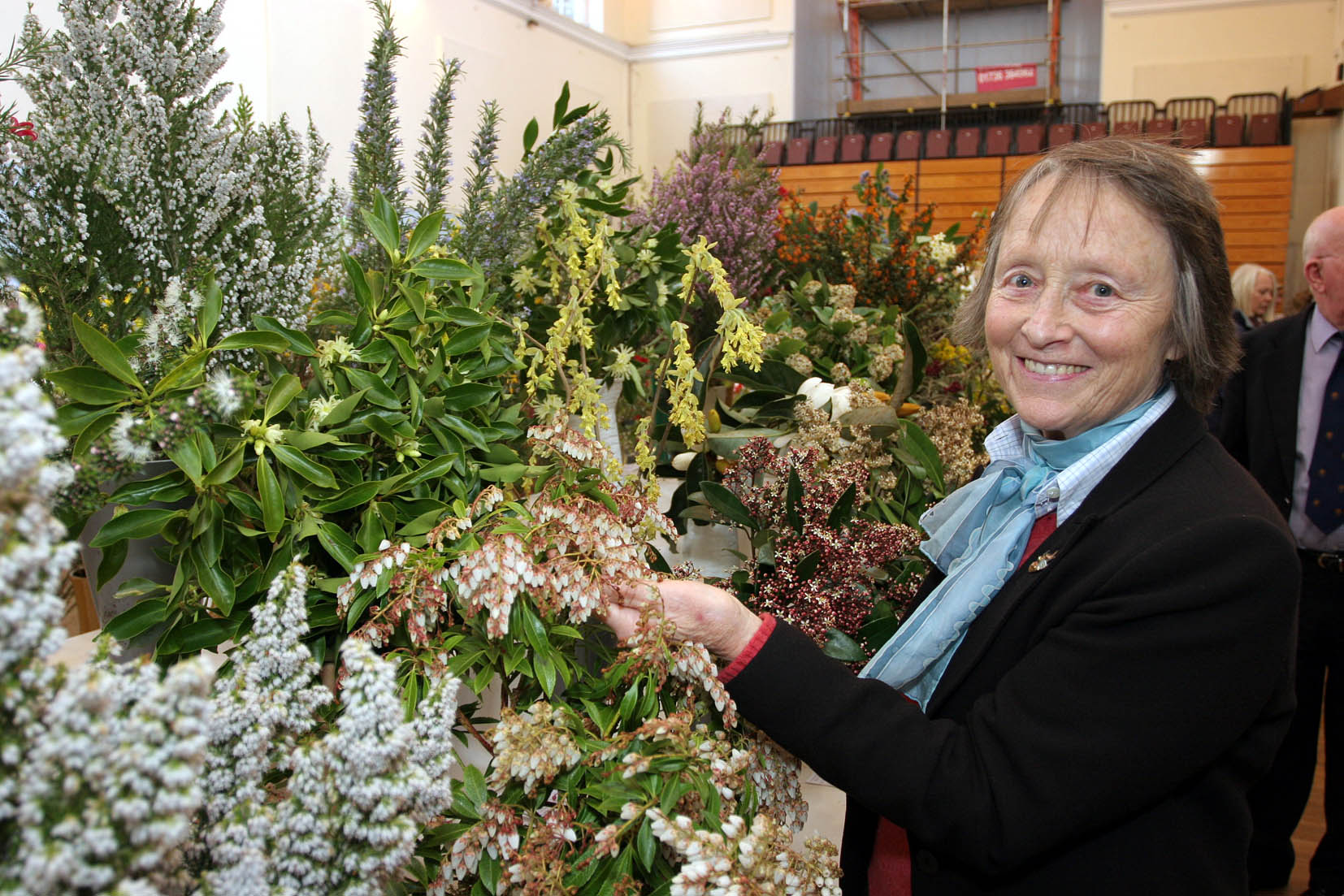 The 84th West Cornwall Spring Show organised by The West Cornwall Horticultural Society in St JohnÕs Hall Penzance. Lady Banham from Penberth Gardens checks her entry of six shrubs which took 1st place in the Ornamental Shrub Section. Pic by Roger Pope/CIOSP